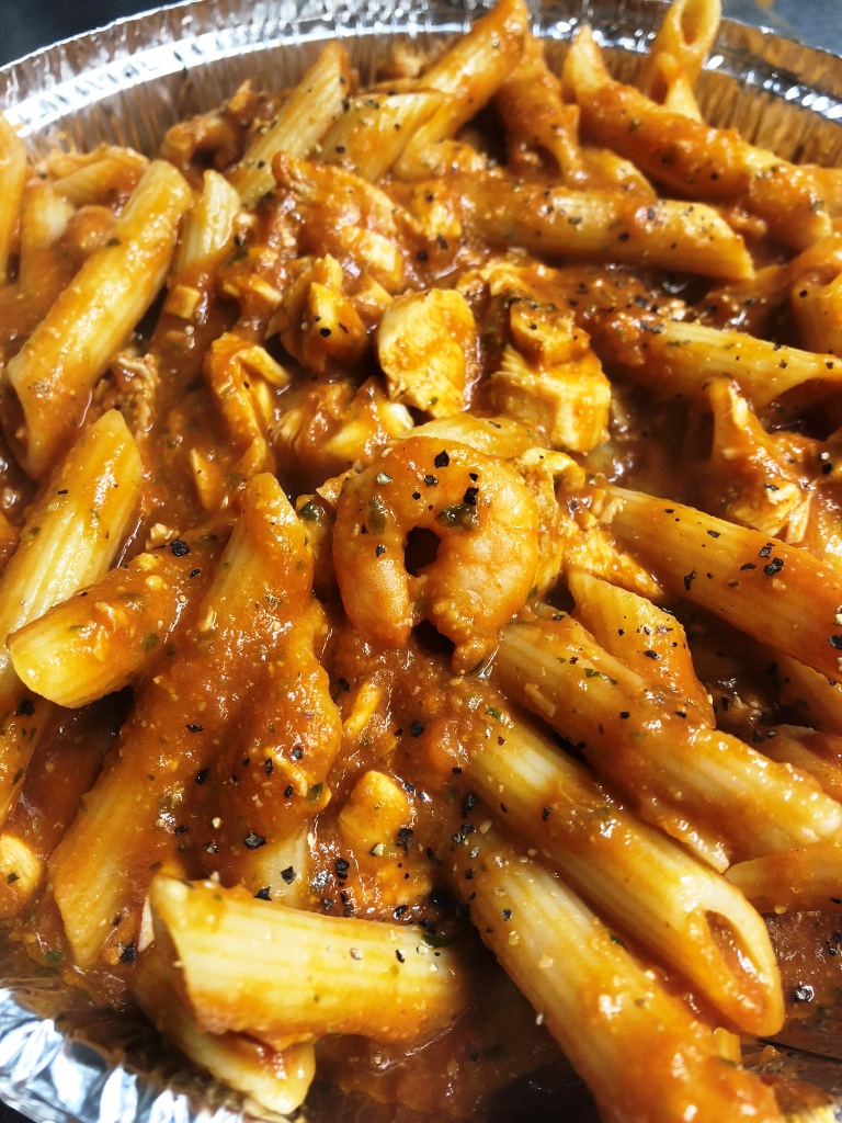CASANOVA penne pasta with chicken, prawns in our unique red pesto sauce £8.95